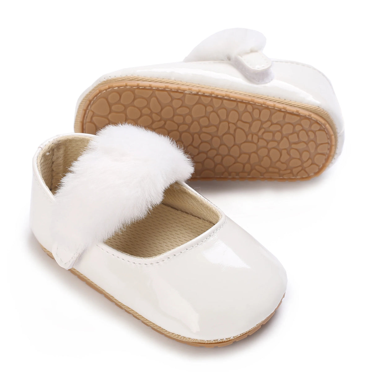 White soft non-slip baby first walker shoes with a faux fur trim and light brown textured sole