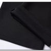 Black men's stretch straight-leg trousers folded and displayed on a white surface.