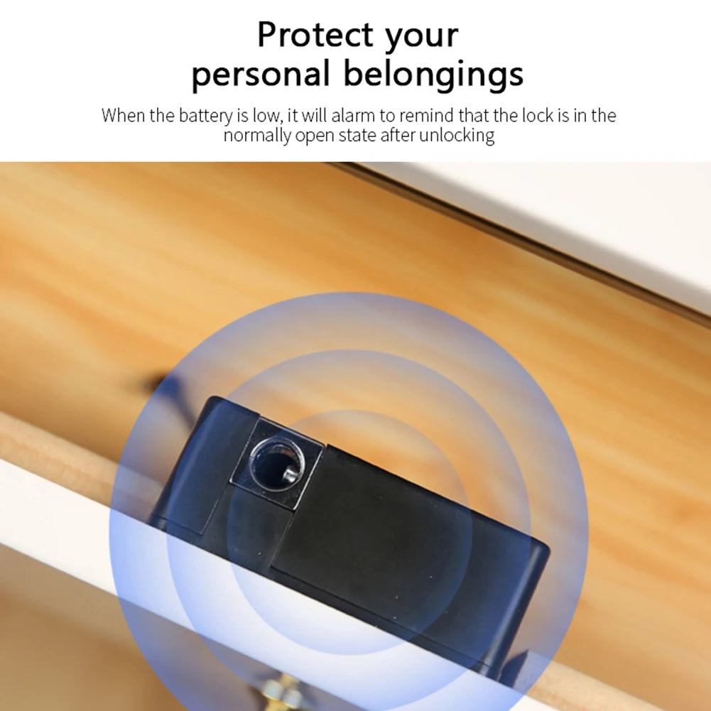 A black keyless smart lock is shown inside a wooden cabinet drawer, with a glowing blue ring indicating the lock's status.