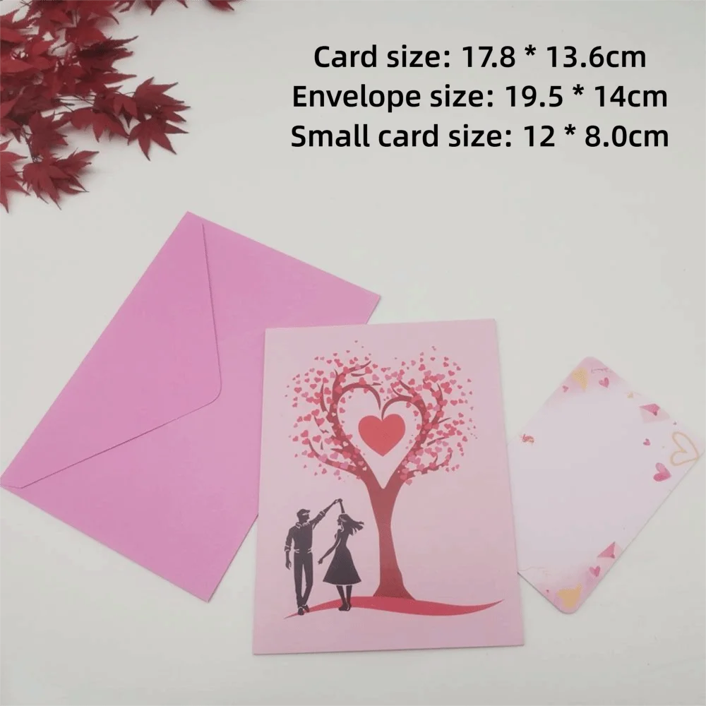 A pink card featuring a red heart-shaped tree silhouette with a couple standing beneath it.