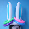 A set of white plastic Easter eggs with blue and pink accents, used for a game.