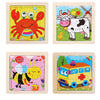 Three wooden jigsaw puzzles featuring a red crab, a white cow, and a yellow bee.