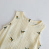 A cream-colored baby cotton sleeveless jumpsuit bodysuit set with small olive leaf embroidery.