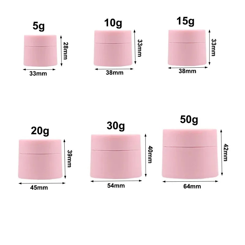 A set of refillable travel face cream jars in various sizes (5g, 10g, 15g, 20g, 30g, 50g) with pink lids and measuring markin