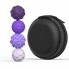 A stack of four purple silicone magnetic sensory fidget balls, including a textured sphere and a faceted ball, next to a blac