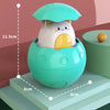 A light teal bath toy featuring a cute duck and penguin head with a water spray function, shown on a tiered platform.