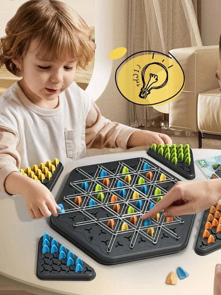 A child and adult are playing a Chain Triangle Chess Game using rubber bands on a dark silicone board.