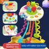 A silicone pull string sensory toy with various colored parts and strings for baby teethers
