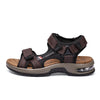 A pair of brown men's genuine leather air cushion sandals with black straps and a light tan sole.