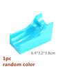 A light blue marble run building block piece with tracks and funnels.