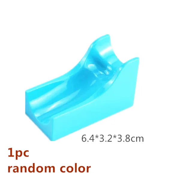 A light blue marble run building block piece with tracks and funnels.
