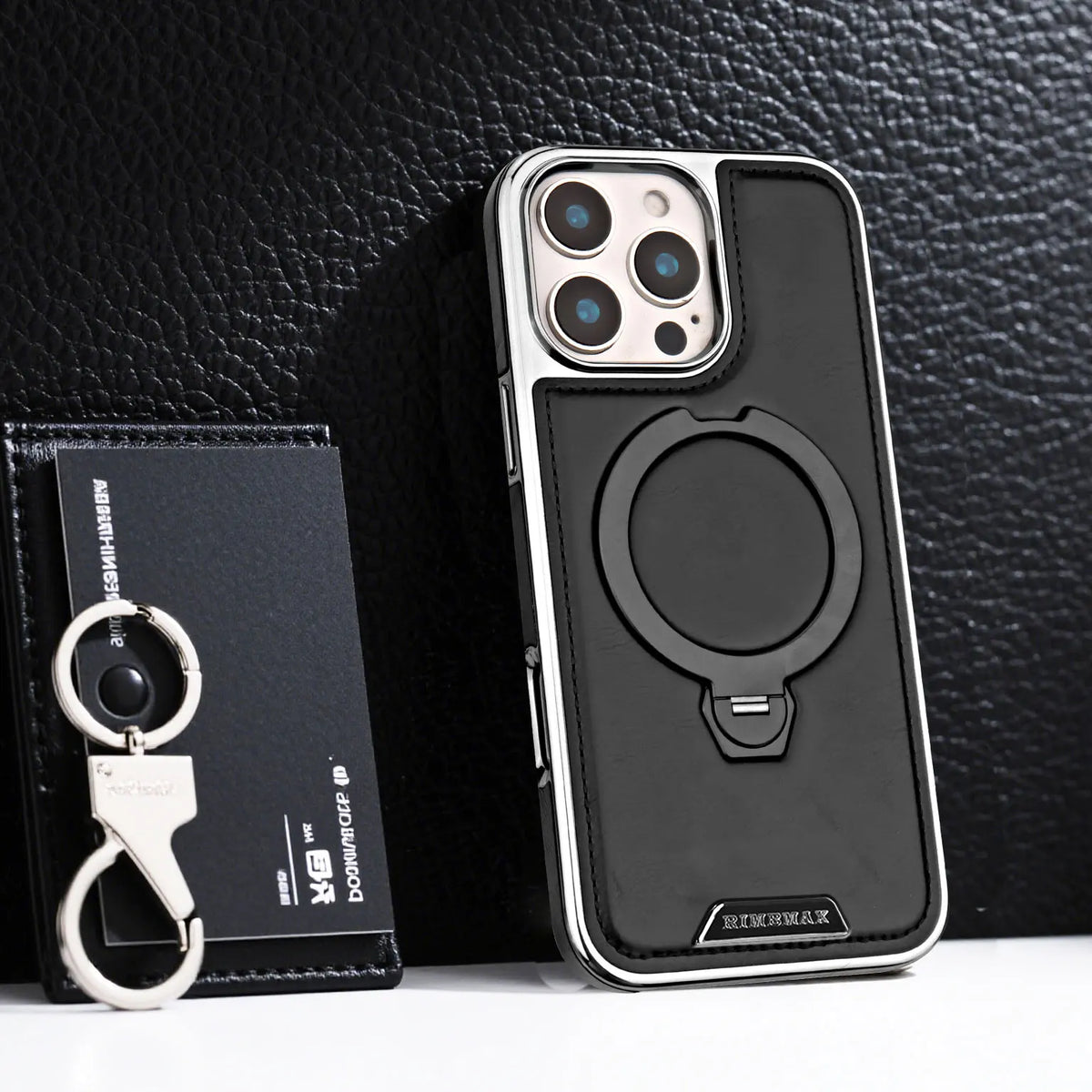 A black magnetic stand case for iPhone with a leather finish and a rotating magnetic ring.
