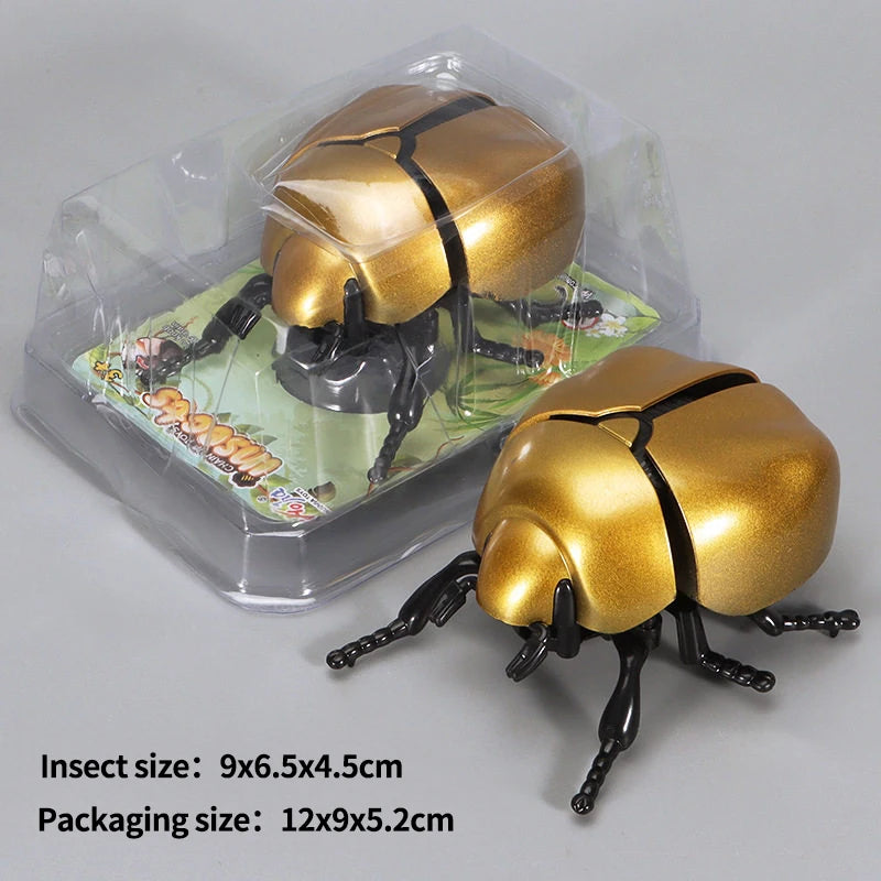 A golden wind-up insect toy, resembling a ladybug or bee, is shown inside its clear plastic packaging.