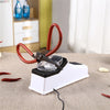 A red electric knife sharpener with a protective cover rests on a beige cloth.