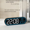 A black digital wall clock displaying the time 22:08, temperature 28°C, and date information.