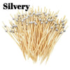 A bundle of silver pearl bamboo skewers used for party appetizers and desserts.
