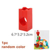 A single red marble run building block piece with a funnel shape and track component.