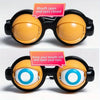 A pair of novelty glasses with yellow lenses, designed to keep the mouth open and eyes closed.