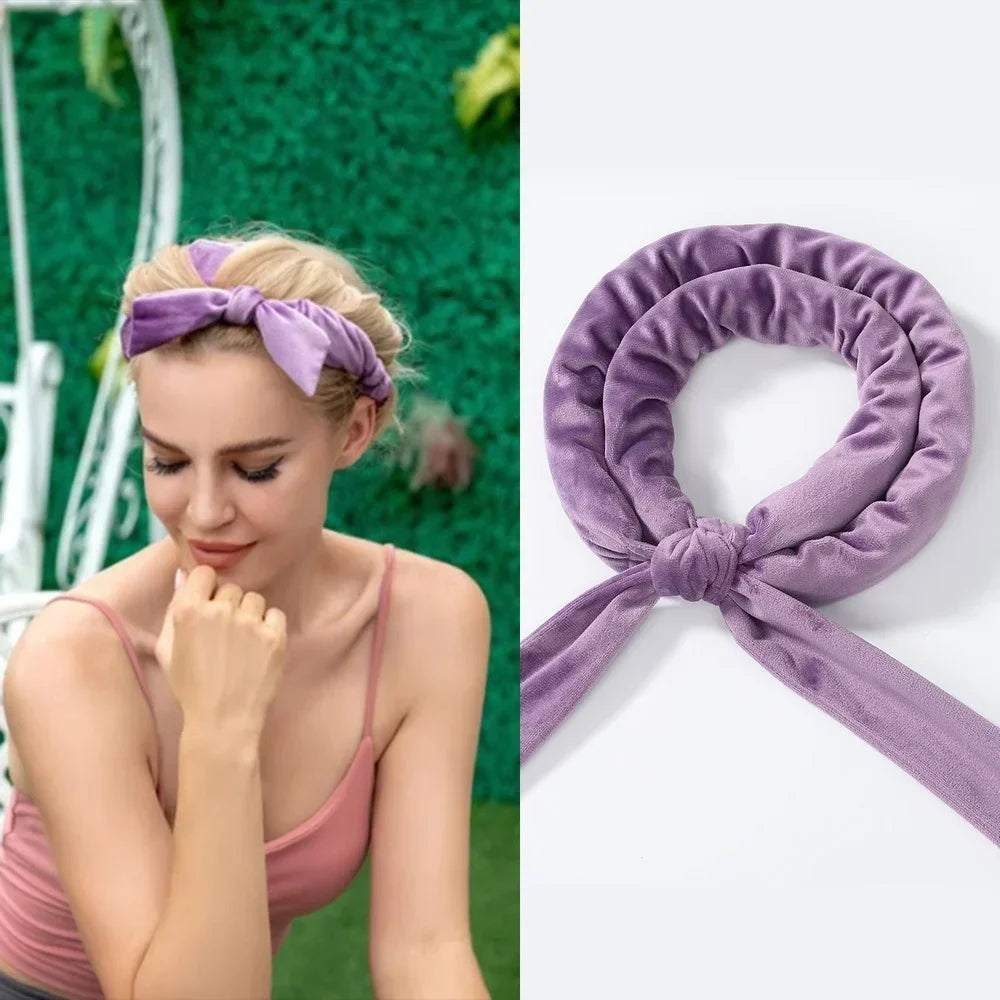A close-up of a woman wearing a purple heatless curling rod headband, showing the product detail and styling.