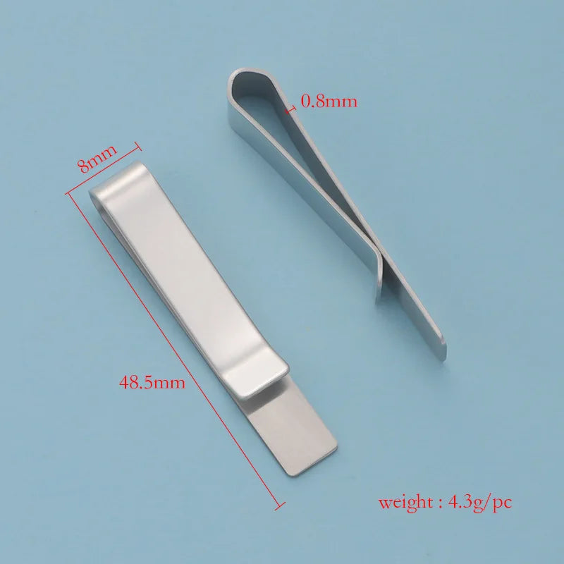 A silver metal tie clip shown with dimensions and weight specifications.
