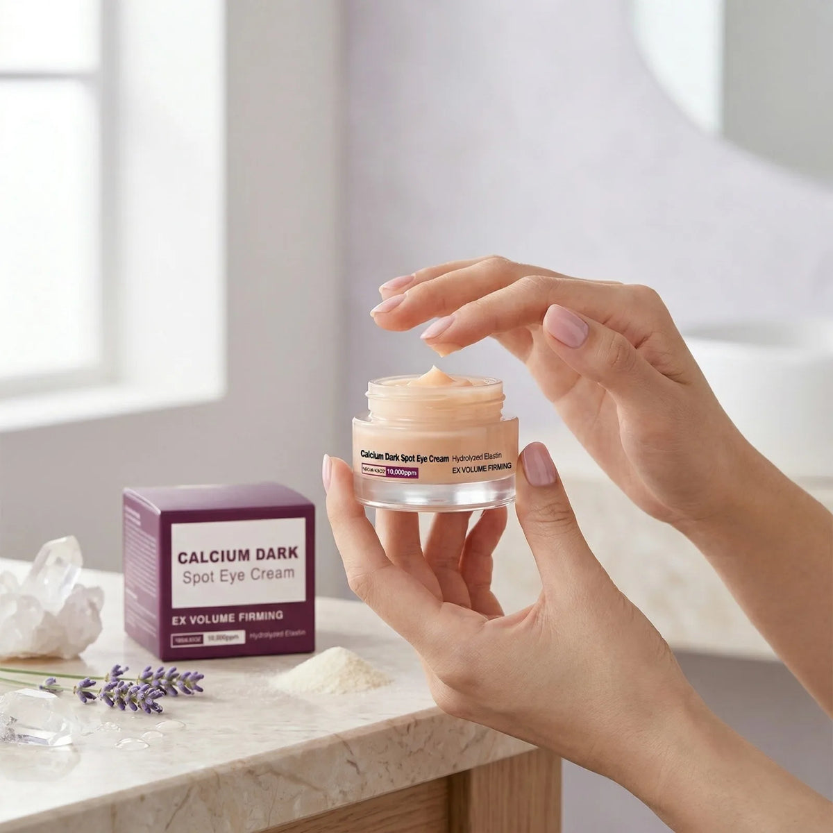 A hand holds a jar of Calcium Dark Spot Eye Cream for firming with hydrolyzed elastin and hyaluronic acid on a marble surface