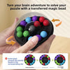 A hand holds a black puzzle ball with colorful beads, demonstrating how to solve a puzzle by connecting beads to a slot.