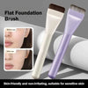 A purple flat foundation brush is shown next to a white one, highlighting its soft bristles for sensitive skin.
