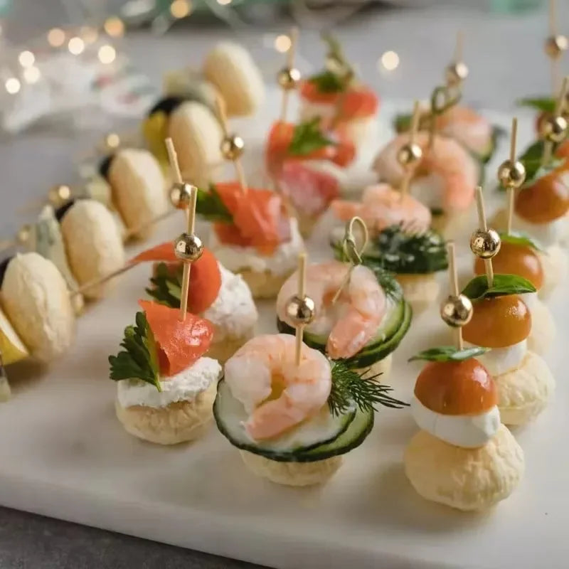 Elegant pearl bamboo skewers featuring shrimp and vegetables arranged for party appetizers