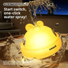A yellow light-up whale bath toy is shown spraying water, designed to attract a baby's attention.