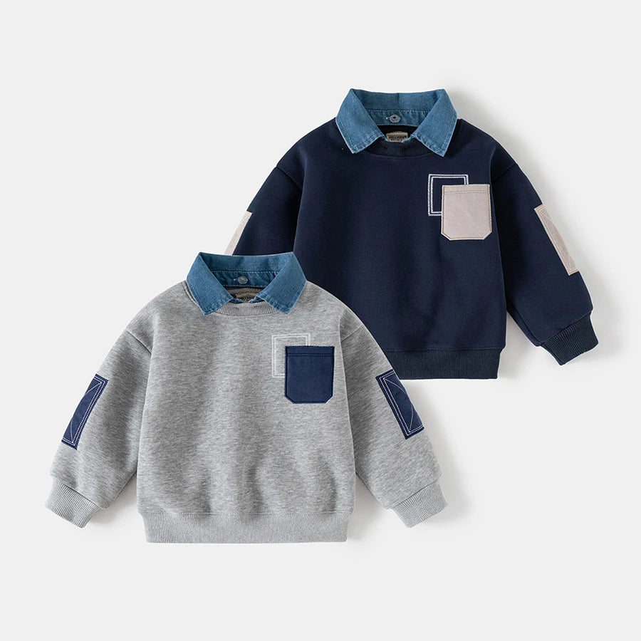 A navy blue fleece pullover sweatshirt with a denim collar and pocket details, shown in a flat lay.