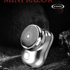 A silver mini razor is shown against a dark background with textured surfaces and the COOL logo.