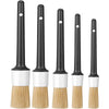 A set of five black detailing brushes with white handles and natural bristles for cleaning.