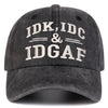 A dark gray letter-embroidered baseball cap featuring the text IDK, IDC, & IDGAF.