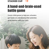 A parent and child are playing a stacked cup game together.