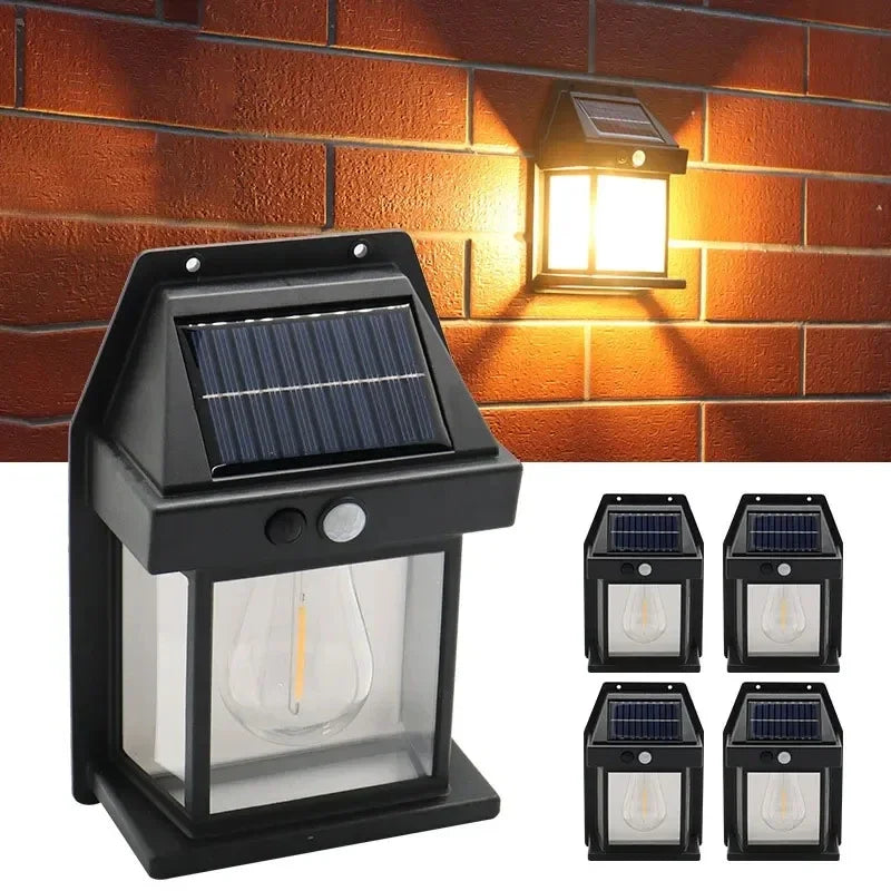 A black solar-powered motion sensor wall light fixture mounted on a brick wall.