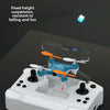 A white mini drone with blue accents is shown on a dark surface, ready for flight.