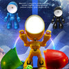 A yellow cartoon hero night light stands on a dark surface with green and red figures surrounding it.