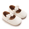 White soft non-slip baby first walker shoes with pearl and floral embellishments