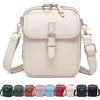 A light beige vegan leather messenger bag with a gold-tone buckle and adjustable strap.