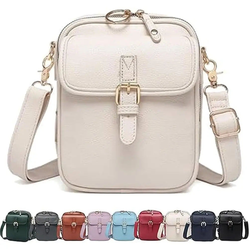 A light beige vegan leather messenger bag with a gold-tone buckle and adjustable strap.