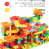 A colorful building blocks structure built from interlocking plastic bricks with various colored pieces and funnel slides.