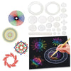 A set of spirograph drawing toys featuring interlocking gears, various discs, and a drawing surface.