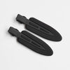 A set of two matte black resin side hair clips lying on a white background.