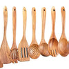 A set of natural teak wood cooking utensils including spatulas, forks, and spoons.