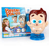 A box of Popping Pimples toy featuring cartoon characters and a plastic face model.