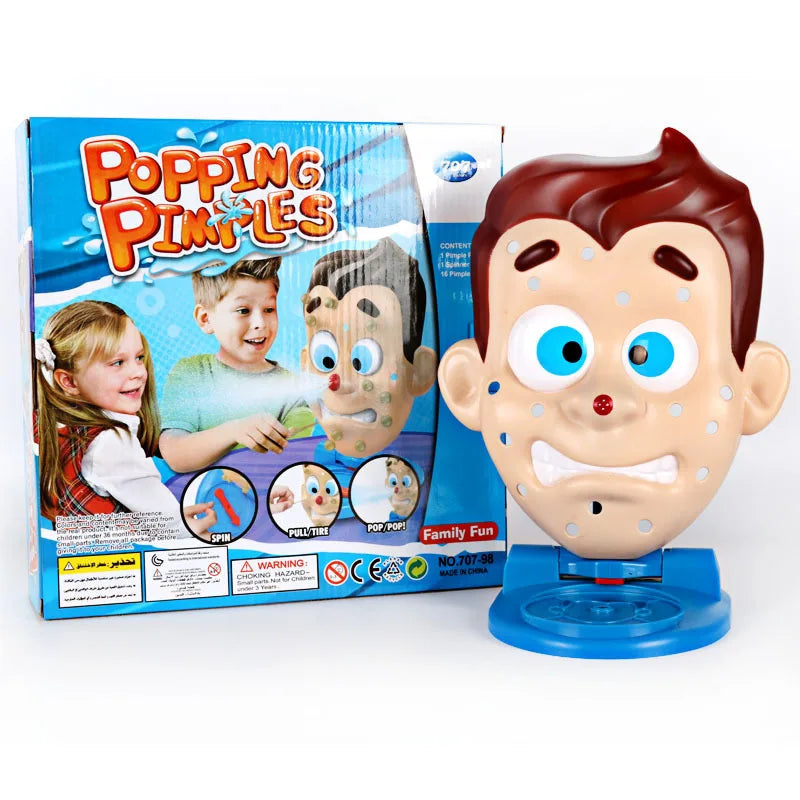 A box of Popping Pimples toy featuring cartoon characters and a plastic face model.