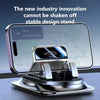 A silver anti-slip silicone car phone mount with a 360 degree rotation feature is shown on a dark surface.