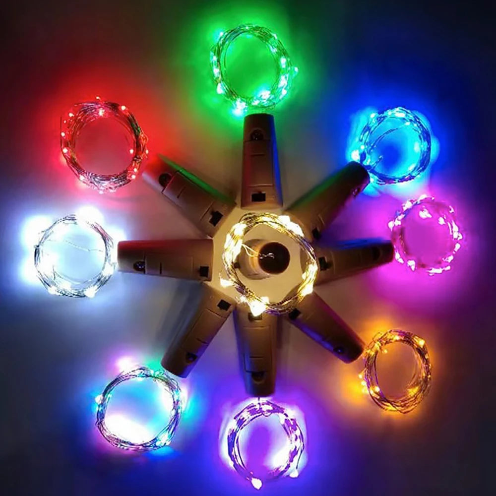 A star-shaped arrangement of multi-colored LED fairy lights illuminating various colors like green, red, blue, and purple.