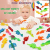 A set of colorful dinosaur finger catapult toys for kids displayed on a white surface.