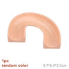 A single piece of a marble run building block track component in a random peach color.